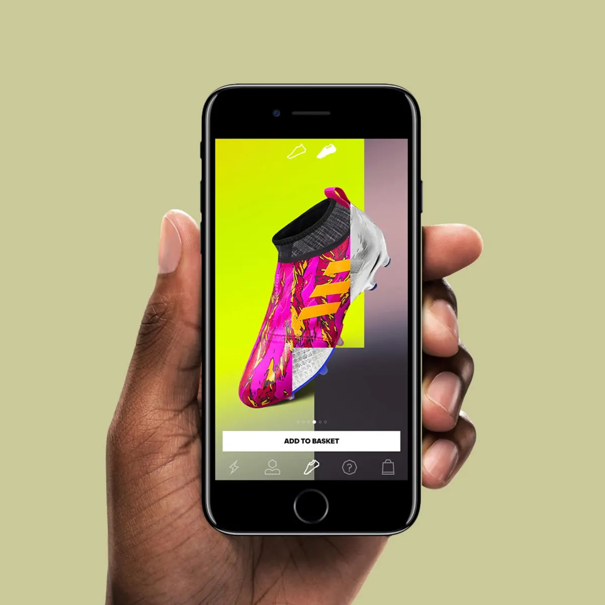 Hand holding a phone showing a GLITCH boot in the app