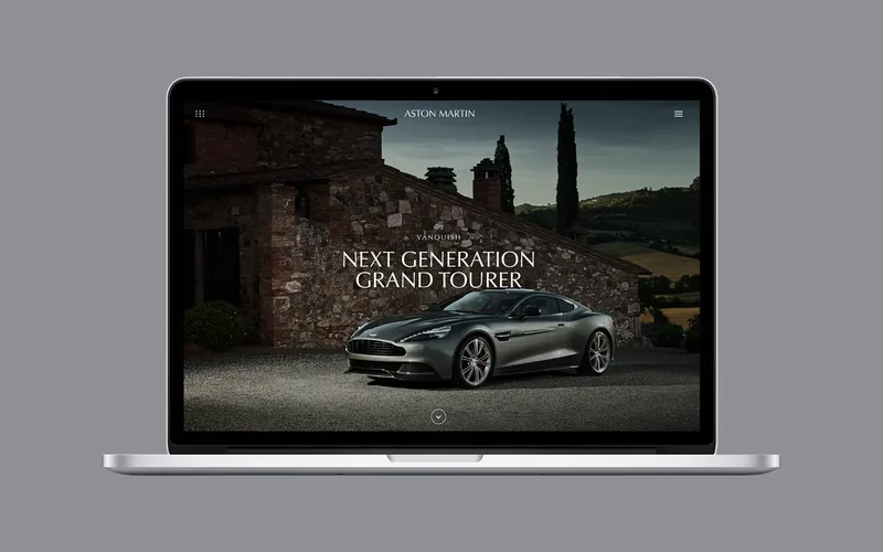 The Aston Martin website on a laptop, showing the Vanquish